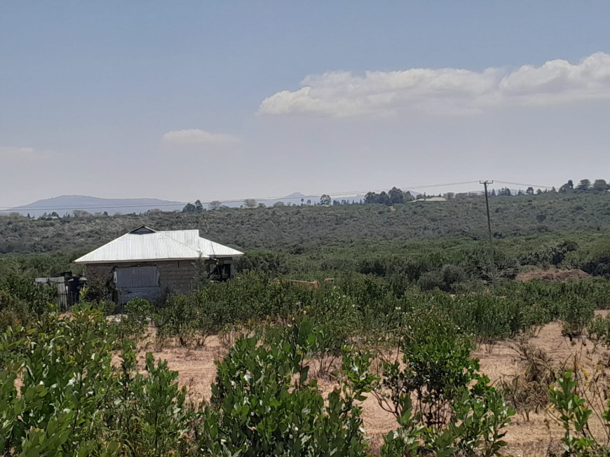 A farmhouse among bush and hills near Nturukuma